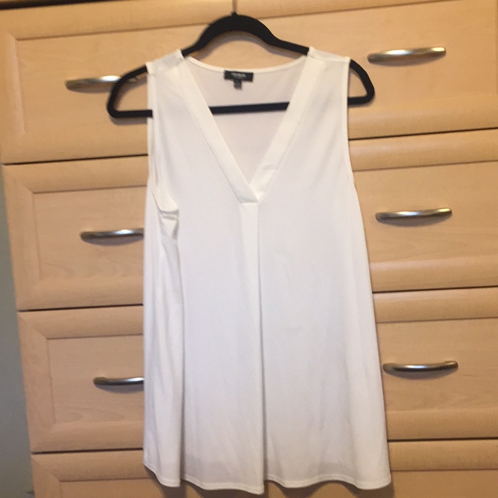 White sleeveless top.